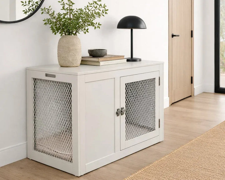 White cabinet with mesh doors in a room setting with decor items.
