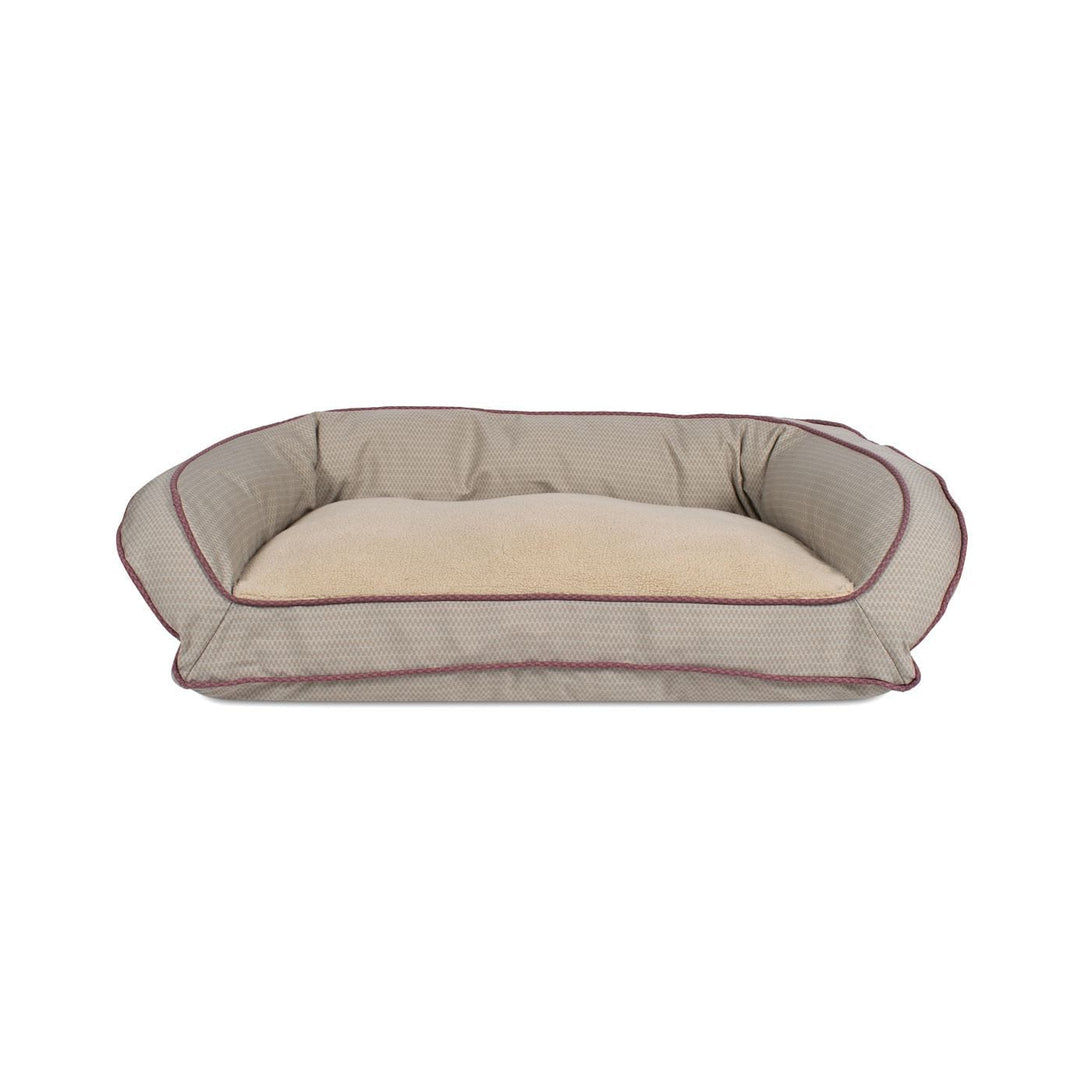 tan bolster dog bed with piping accent