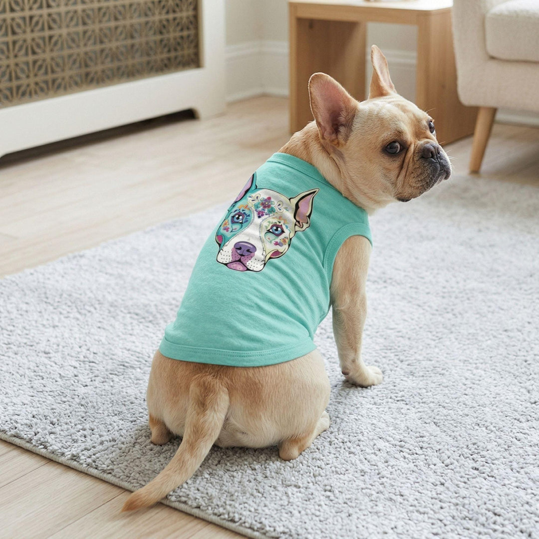  sleeveless mint green shirt with a colorful graphic of a dog's face on the back.